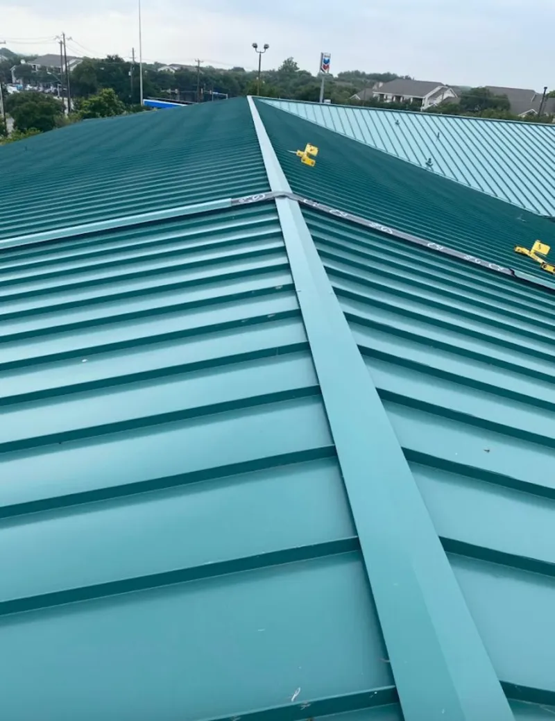 Green commercial metal roof ridge and valley for Metal Roof Repair in Grover Beach