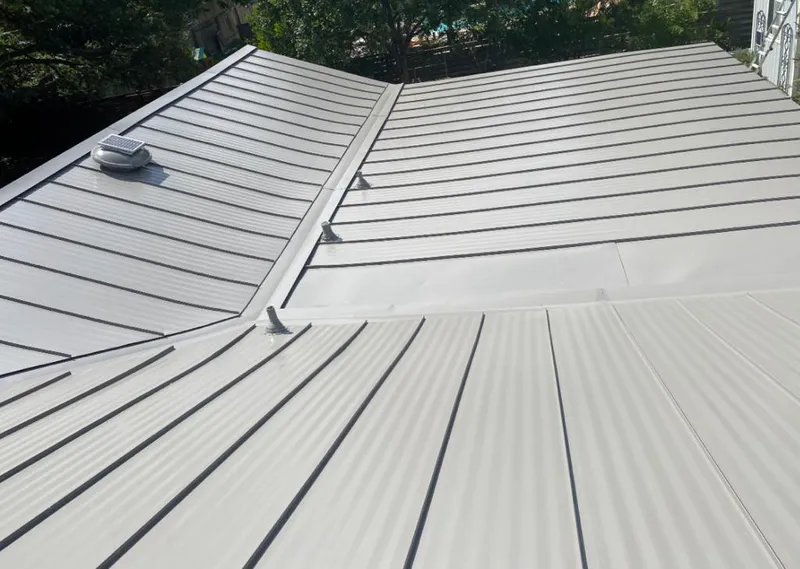 Solar attic fan installed on a metal roof for Roof Ventilation in Grover Beach